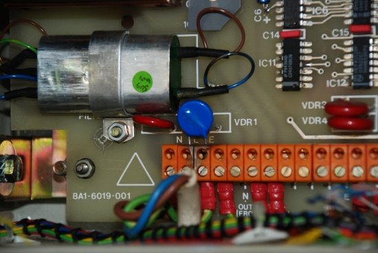 The varistor is the little blue component